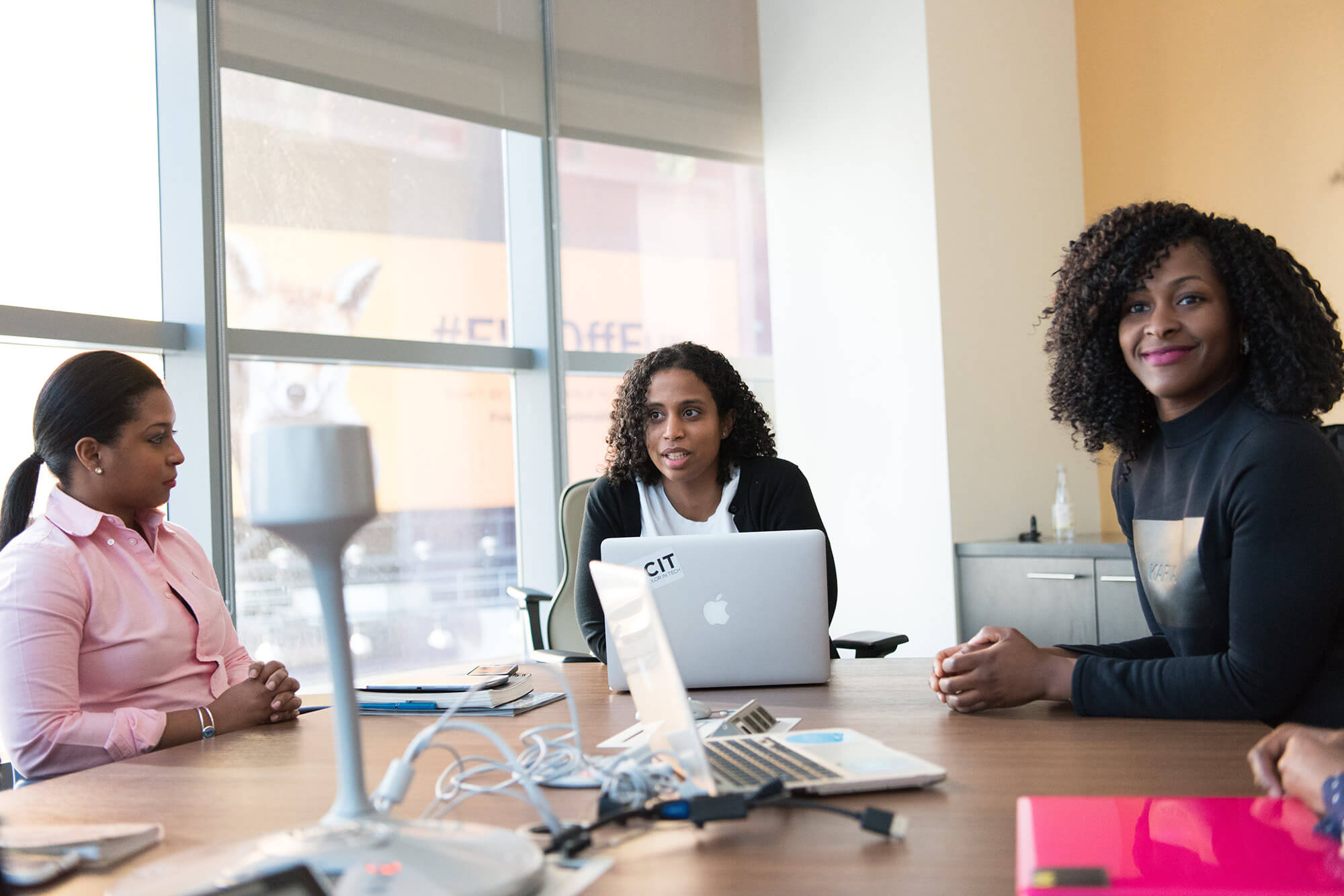 Three women in a business meeting