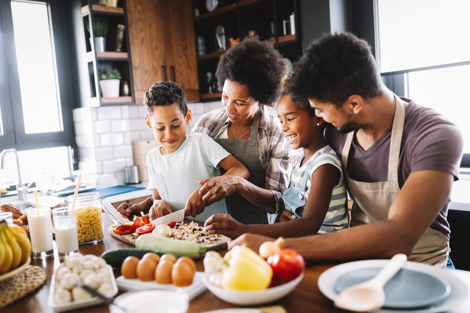 A family preparing a meal in the kitchen together